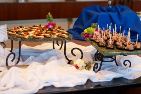 A table with two trays of food on it