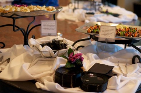 A table with many different types of food on it.