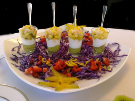 A white plate topped with purple and yellow food.