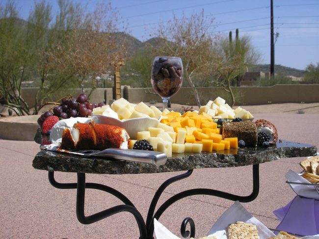 assorted-cheeses A table with cheese and crackers on it
