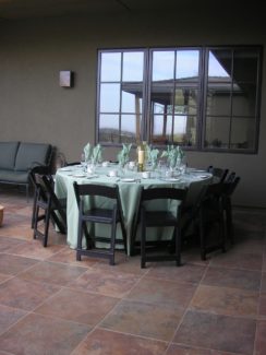 A table set with plates and glasses on top of it.