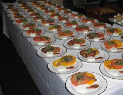 A table full of plates with different types of food on them.
