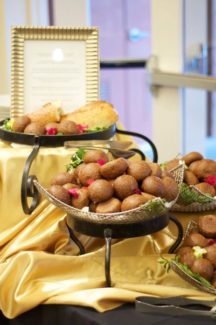 A table with three baskets of food on it
